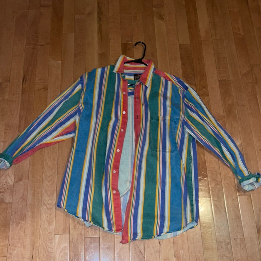 Oversized multicolored striped button up shirt; sturdy yet breathable material;